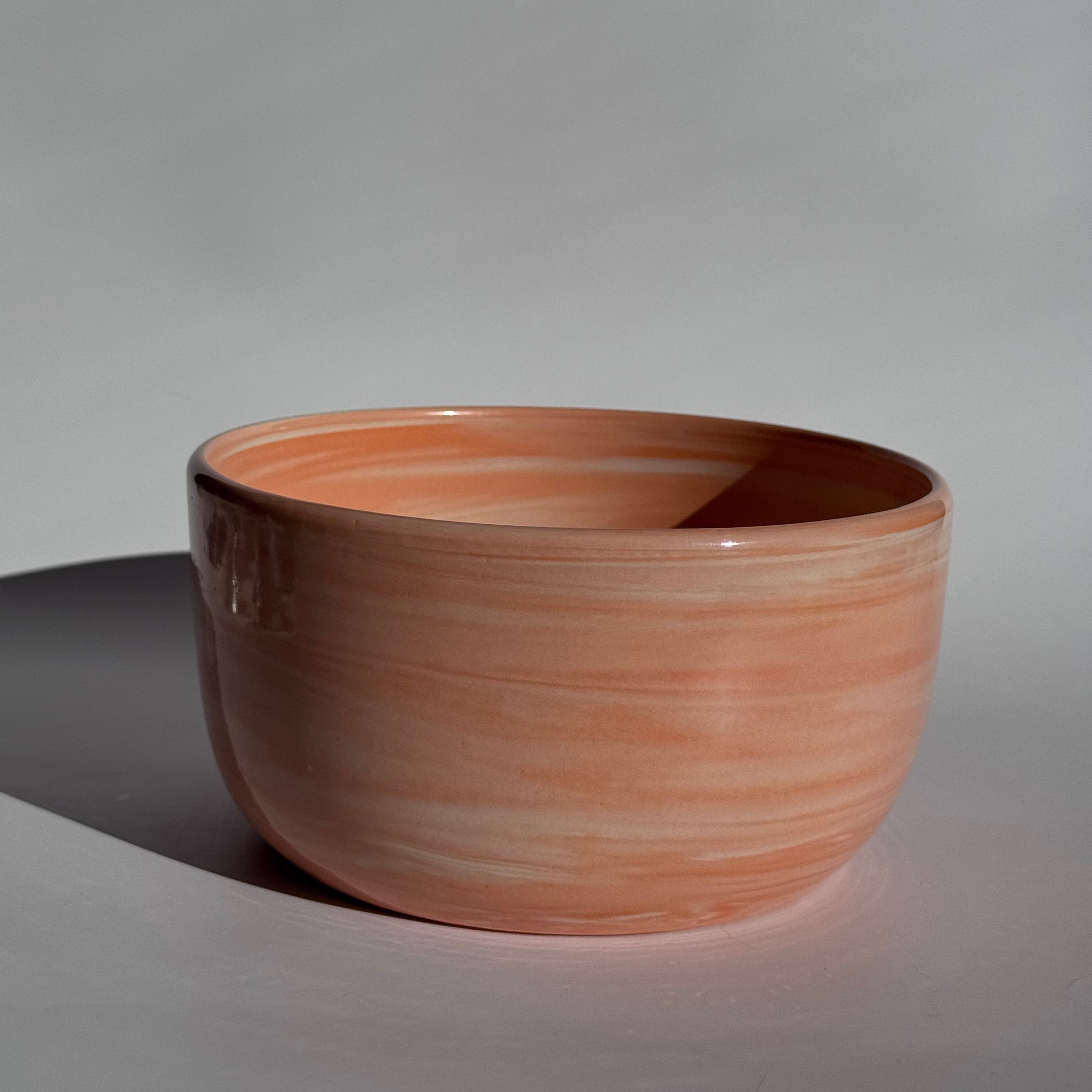 orange and white swirled serving bowl